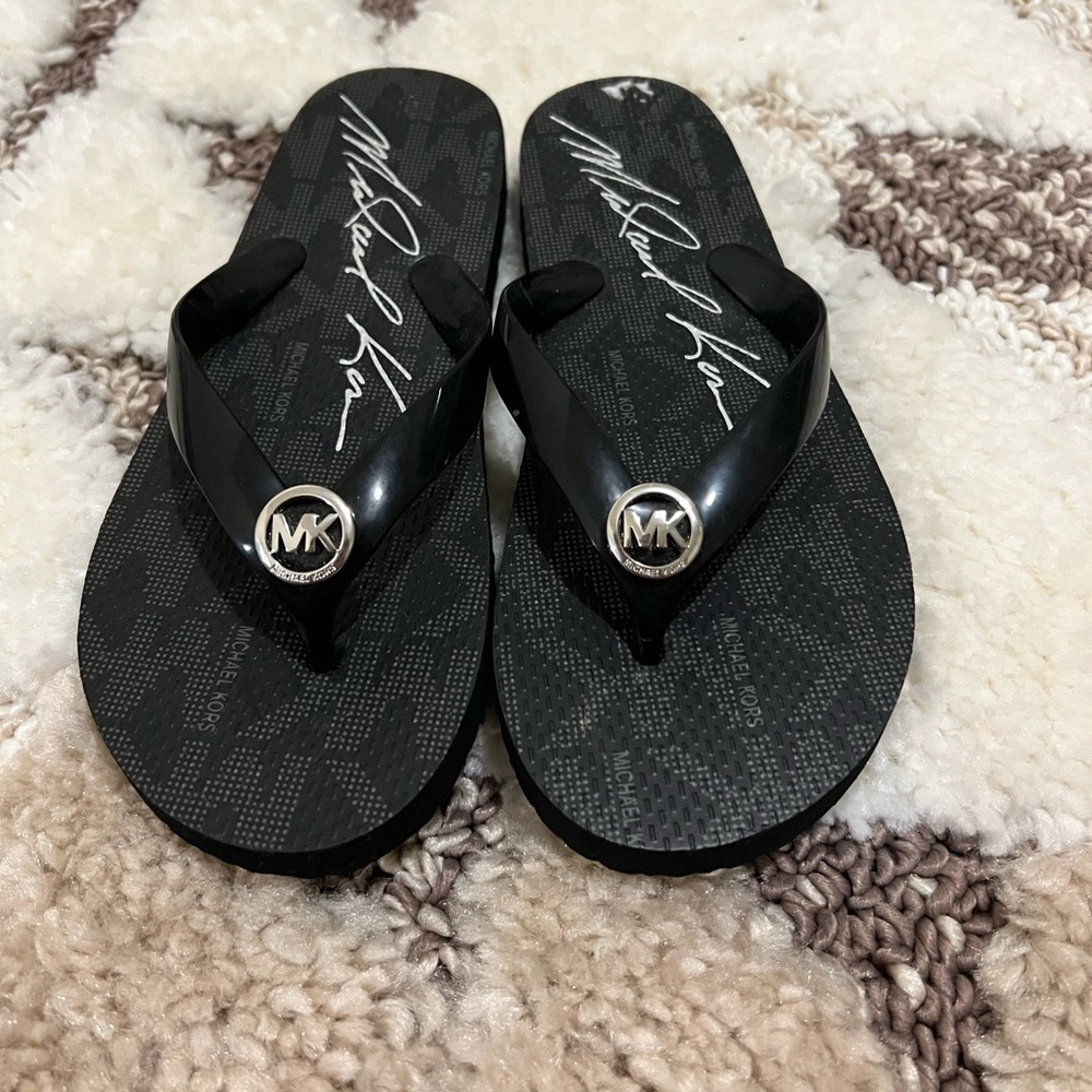 Michael Kors logo flip flops. Size 6